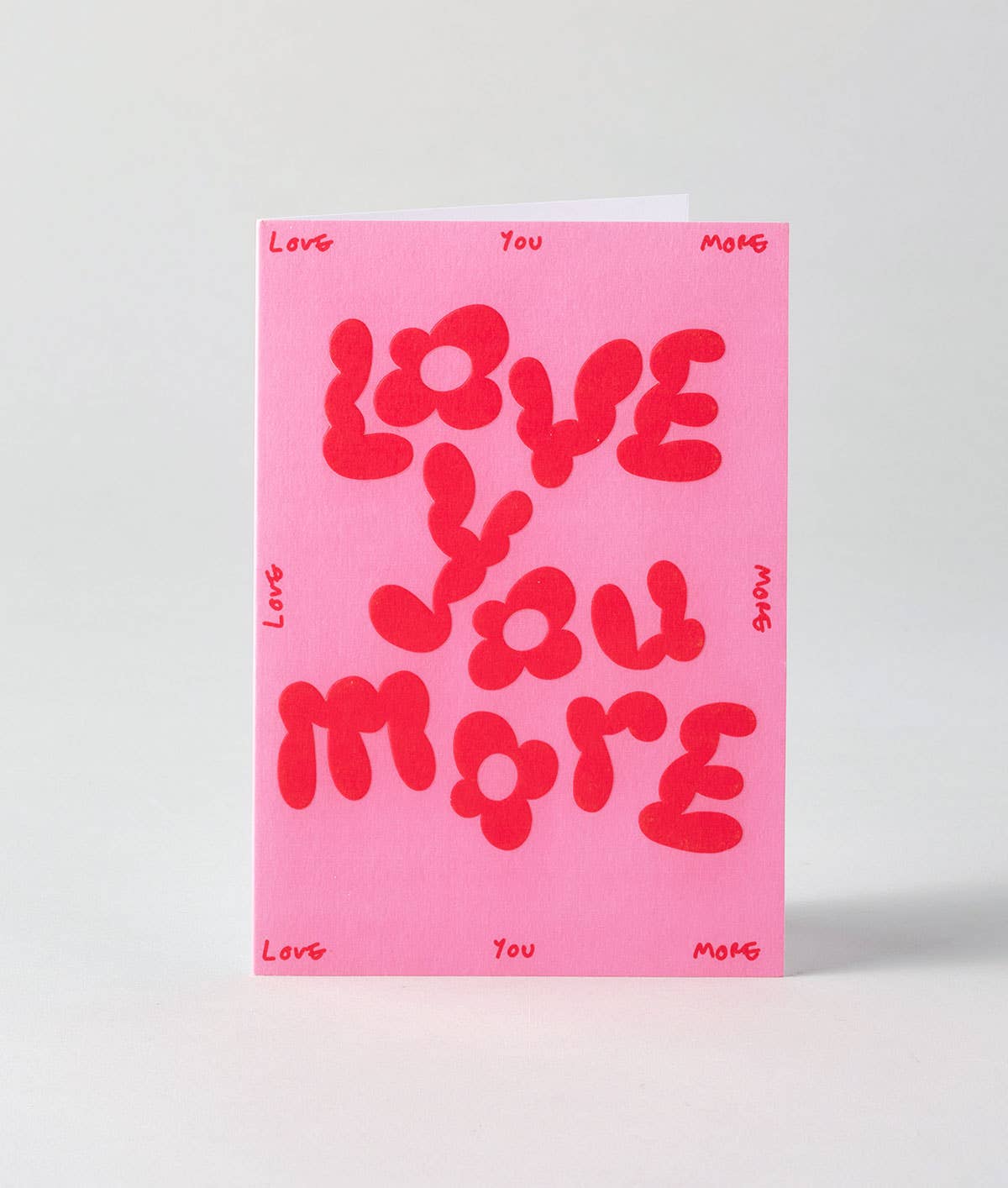 Love You More' Embossed Greetings Card