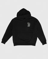 A Place For Diversity Hoodie Schwarz von NKSP – Vorderansicht flach gelegt mit weißem Brustdruck und Kängurutasche