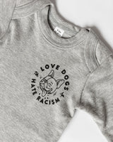 Love Dogs Hate Racism Baby Bodysuit