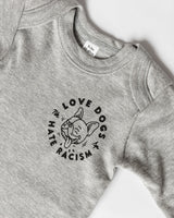Love Dogs Hate Racism Baby Bodysuit